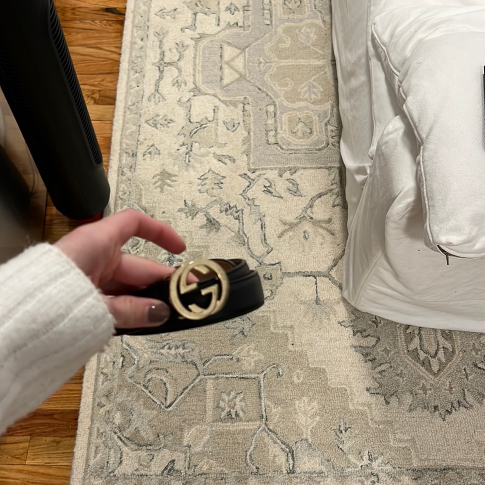 Black and gold Gucci belt